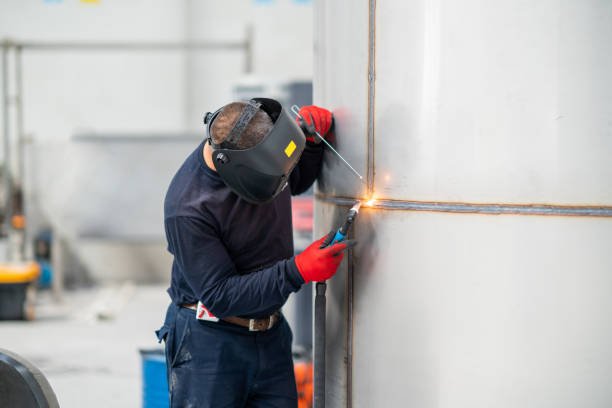 Custom Stainless Steel Welding Portrait of worker working in construction site