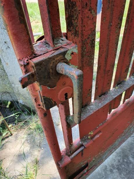 Old iron vintage door with a red-brown door knob, showcasing signs of age and rustic charm, perfect for a historic or traditional home.